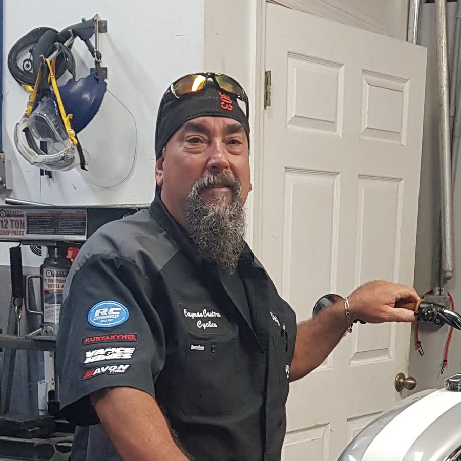 Keith, owner of Cayman Custom Cycles, in the workshop